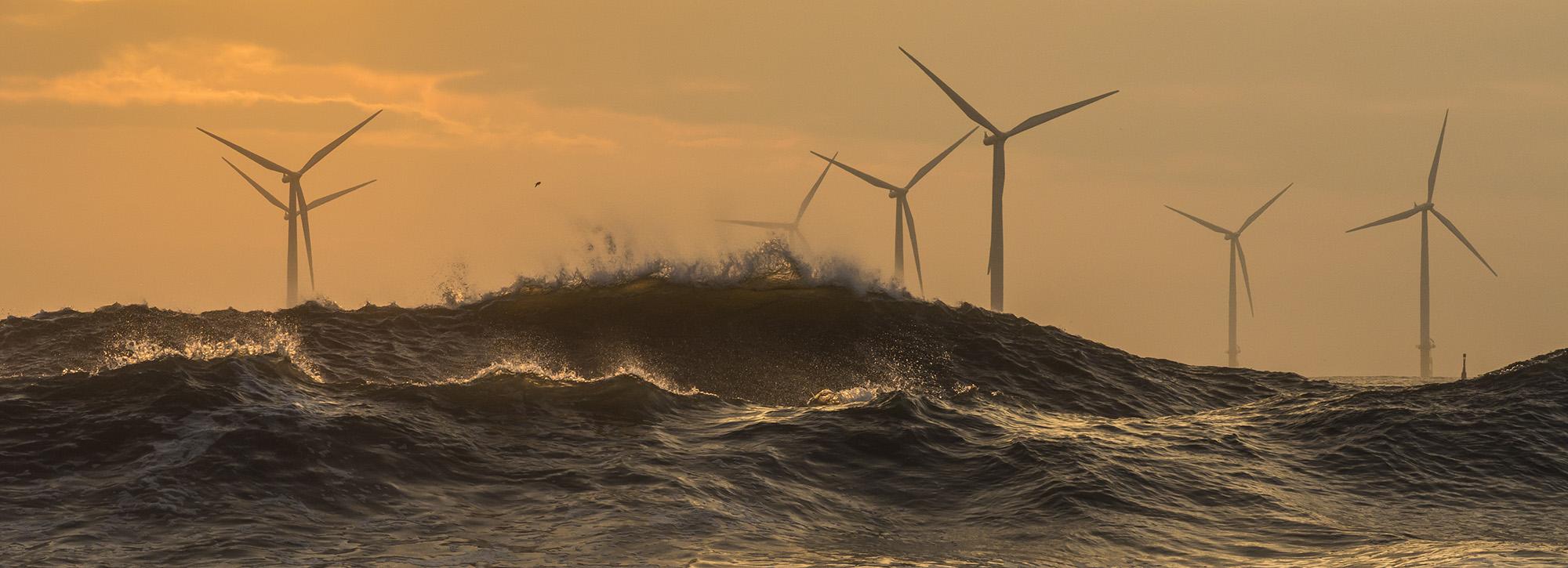 View of offshore wind farm in stormy weather