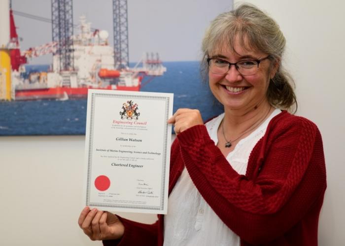 Gillian Watson, holding her certificate