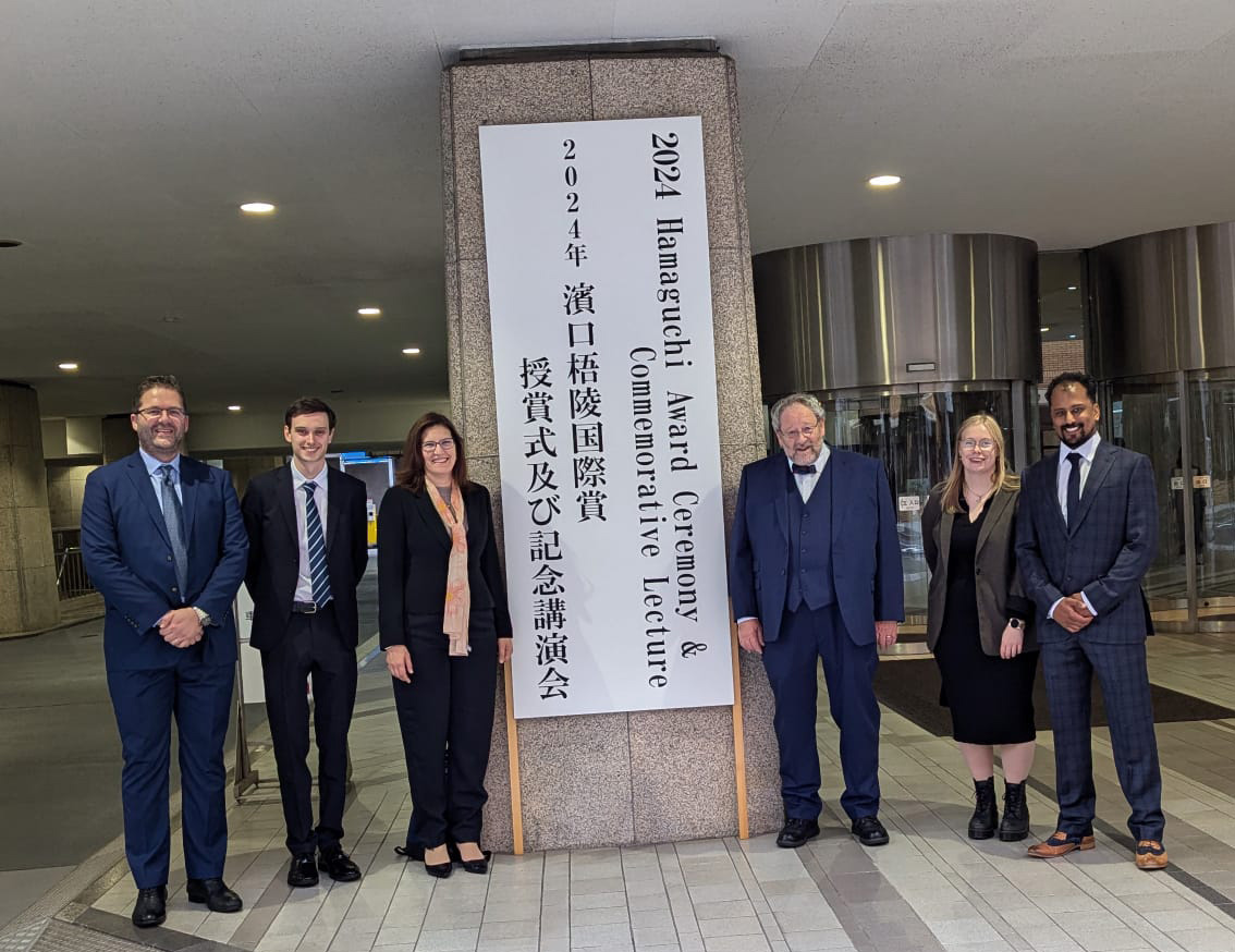 People standing at the entrance of  2024 Hamaguchi  Awards.