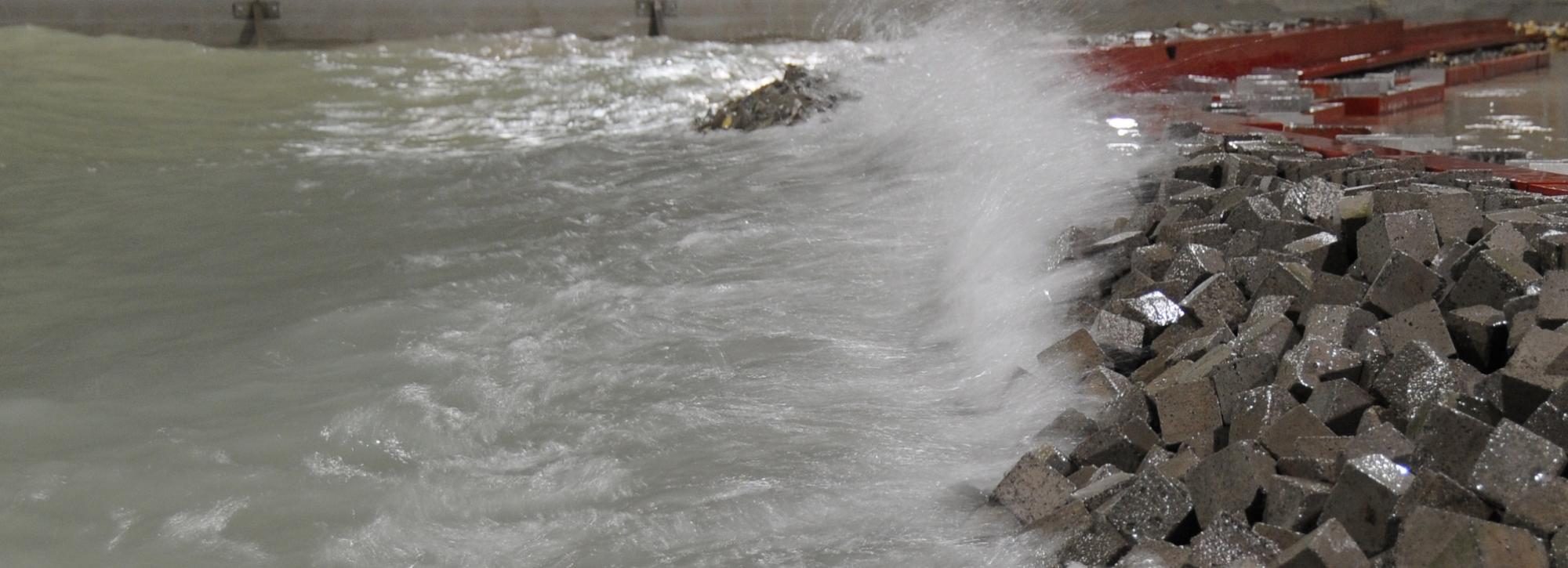 View of a wave crashing on modelled breakwater