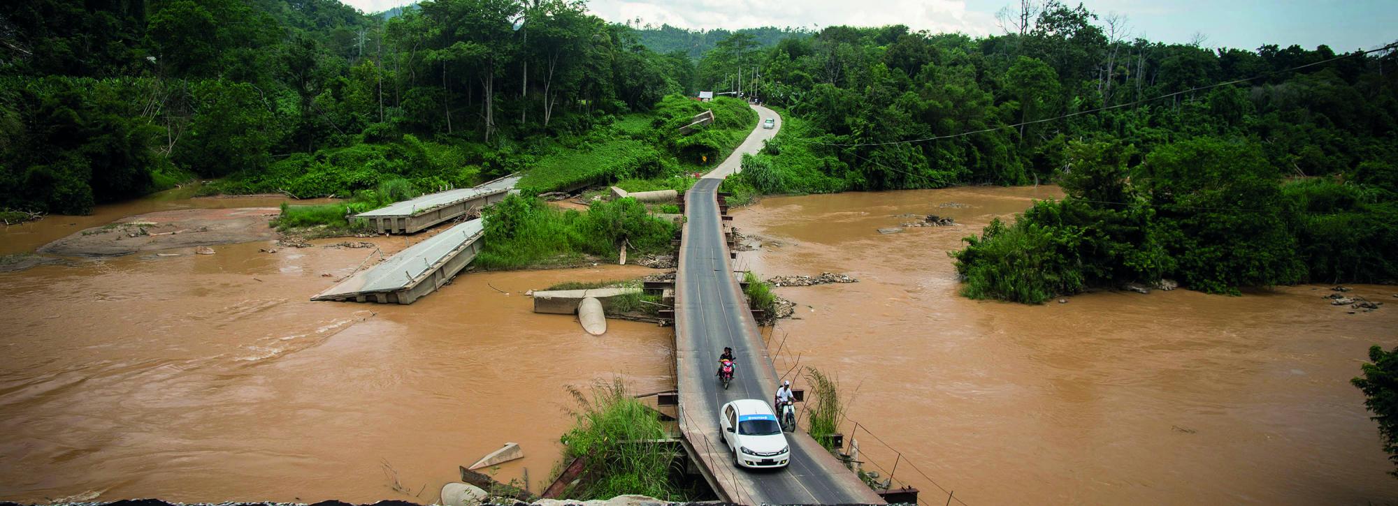 View of a bridge destroyed by flooding in Eastern Malaysia