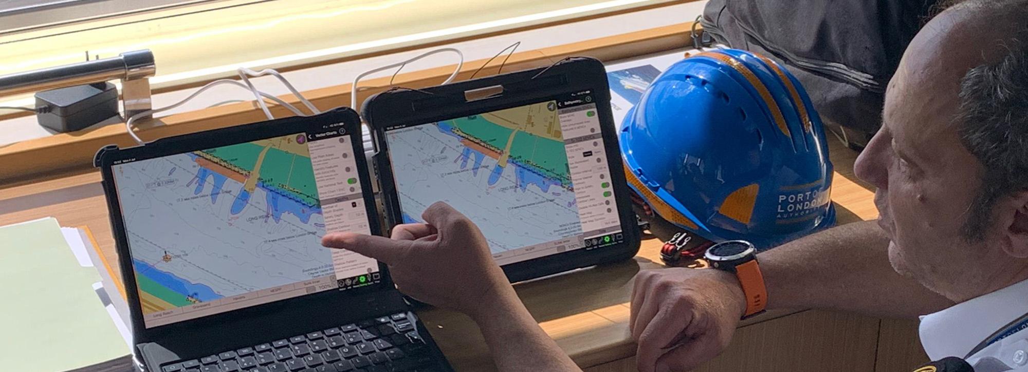 Ship pilot in front of computer screens