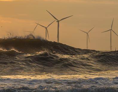 View of offshore wind farms in storm waves