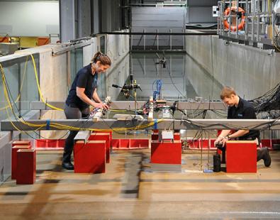 Photo of two people working on the tsunami simulator