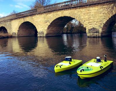 3 ARC-Boat on the river by a bridge