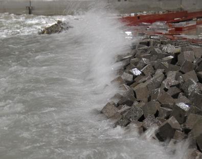 View of waves crashing on modelled breakwater 