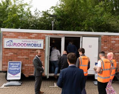 Group of people waiting to enter the BE Flood Smart building at Howbery Park