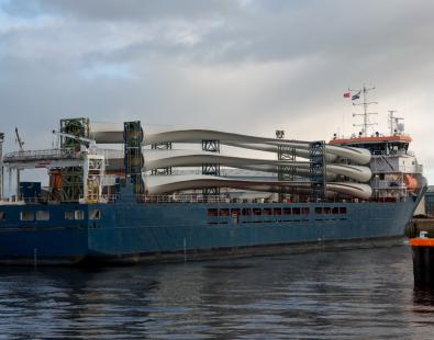 Ship with wind turbines moored at a port