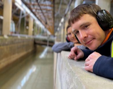 Two engineers looking on physical model of a tsunami 