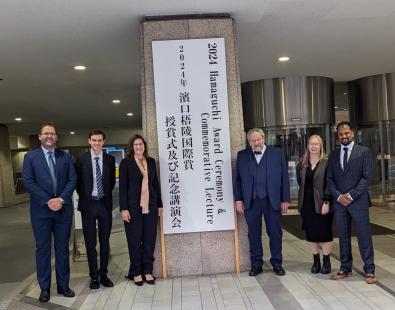 People standing at the entrance of  2024 Hamaguchi  Awards.