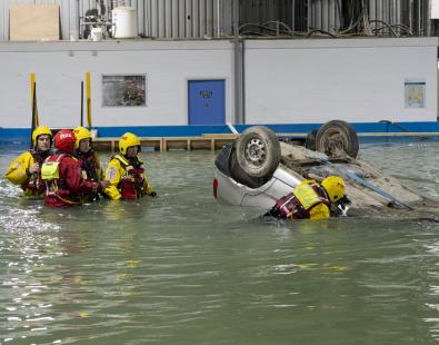 Group of rescue services in training in flooded basin