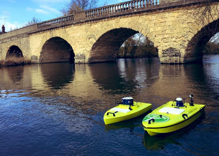 3 ARC-Boat on the river by a bridge