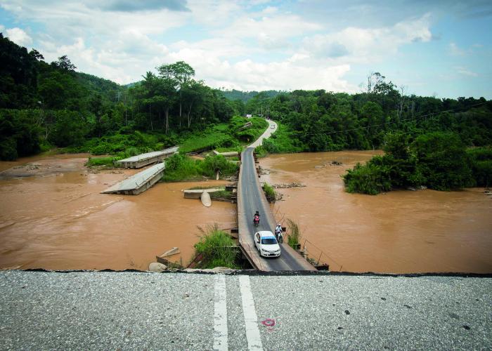 View of a bridge destroyed by flooding in Eastern Malaysia