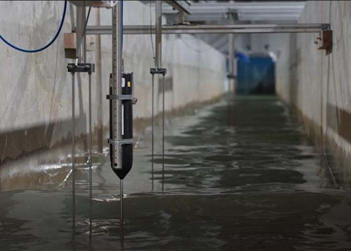 view of a flume physical model with water and instrumentation