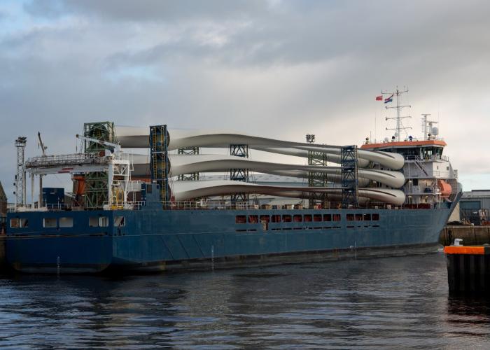 Ship with wind turbines moored at a port