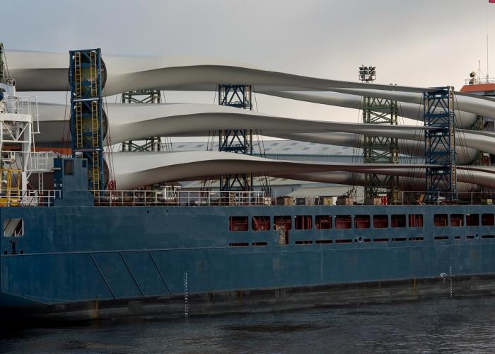 Ship loaded with wind turbines moored at a port