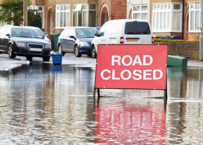warning sign of flooded road