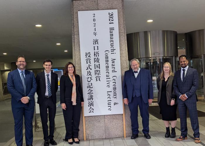 People standing at the entrance of  2024 Hamaguchi  Awards.