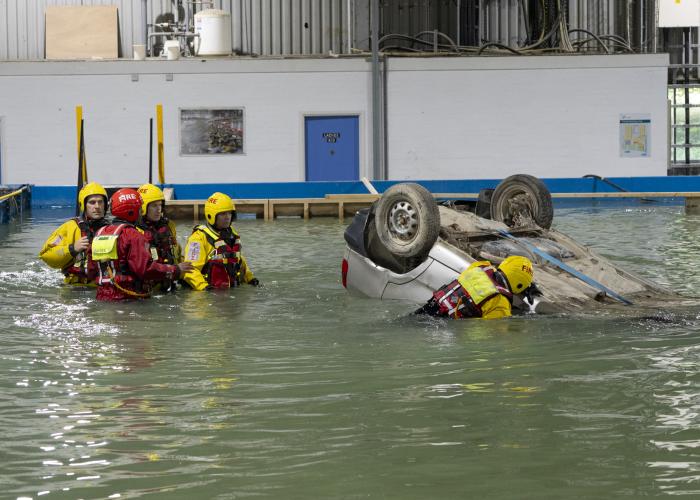 Group of rescue services in training in flooded basin