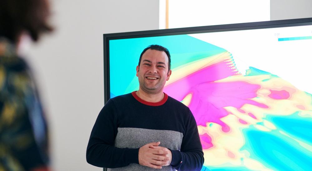 CFD expert, Sina Haeri, in front of presentation screen