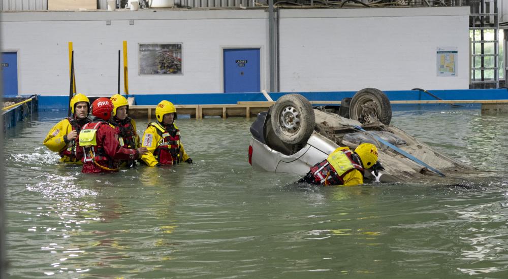 Group of rescue services in training in flooded basin