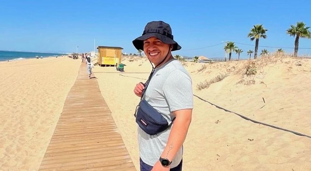 Scientist Sebastian Escobar on a beach