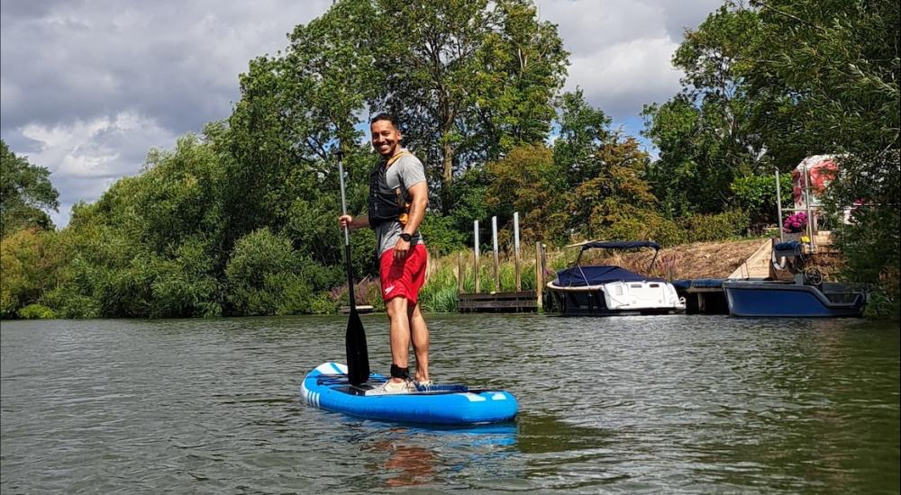 Action shot of Sebastian Escobar on paddle on a river
