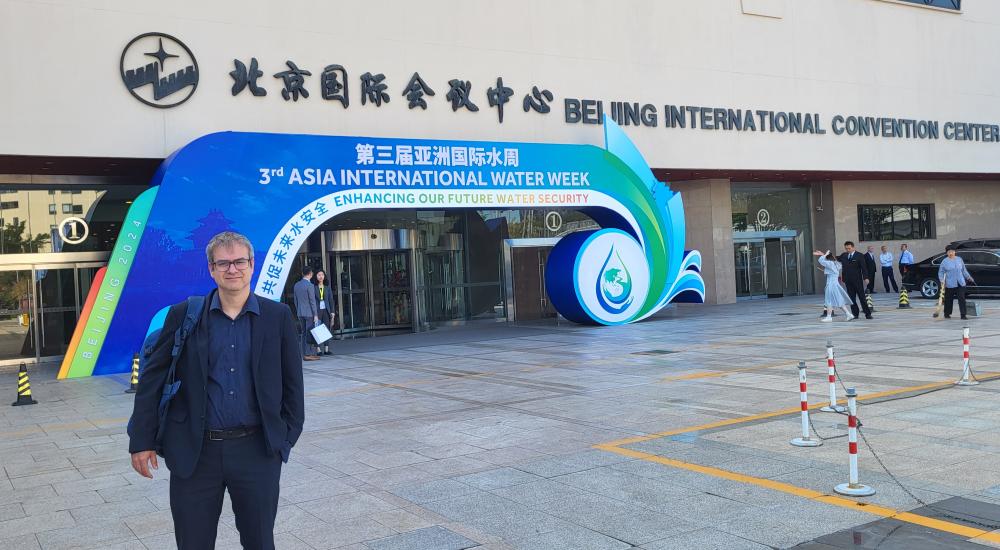 View of Juan in front of entrance to the 3rd Asia International Water Week, 2024