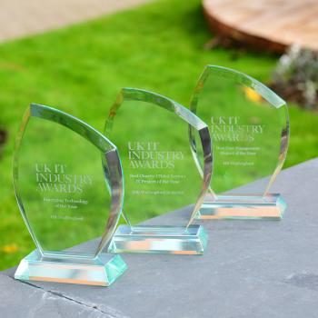 D-MOSS awards lined up outside against a backdrop of green grass