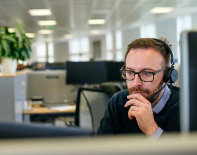 Scientist Connor McCarron sitting at his desk