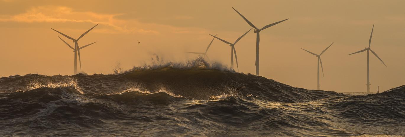 View of offshore wind farm in stormy weather