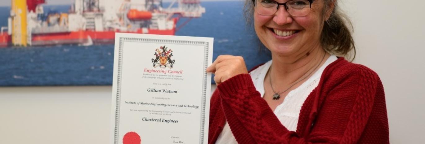 Gillian Watson, holding her certificate