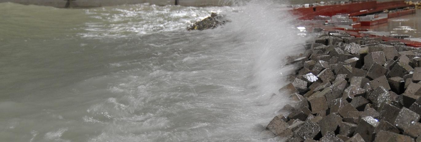 View of a wave crashing on modelled breakwater