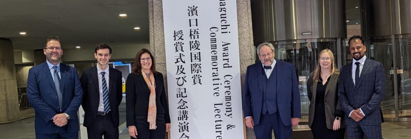 People standing at the entrance of  2024 Hamaguchi  Awards.
