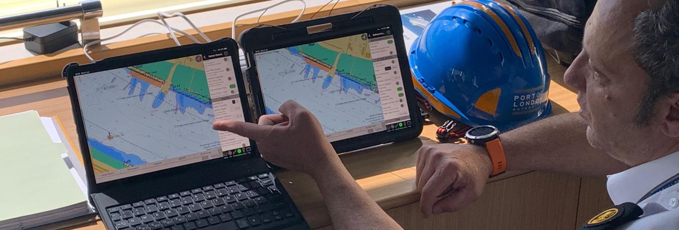 Ship pilot in front of computer screens