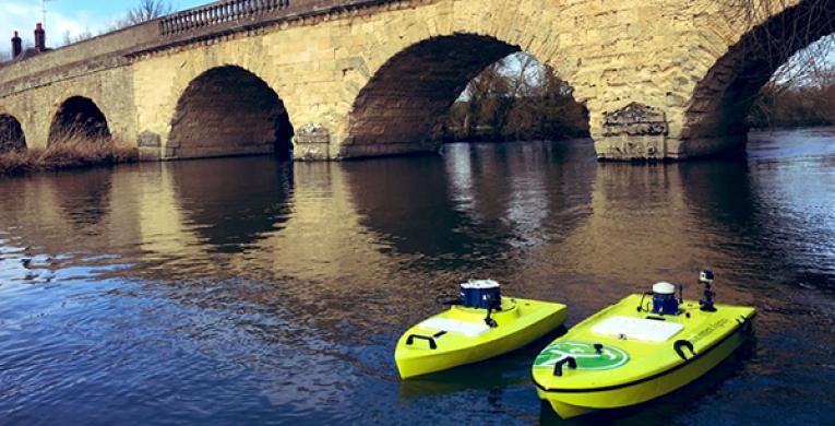 3 ARC-Boat on the river by a bridge